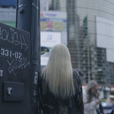 A band member and a blonde woman Front Cover